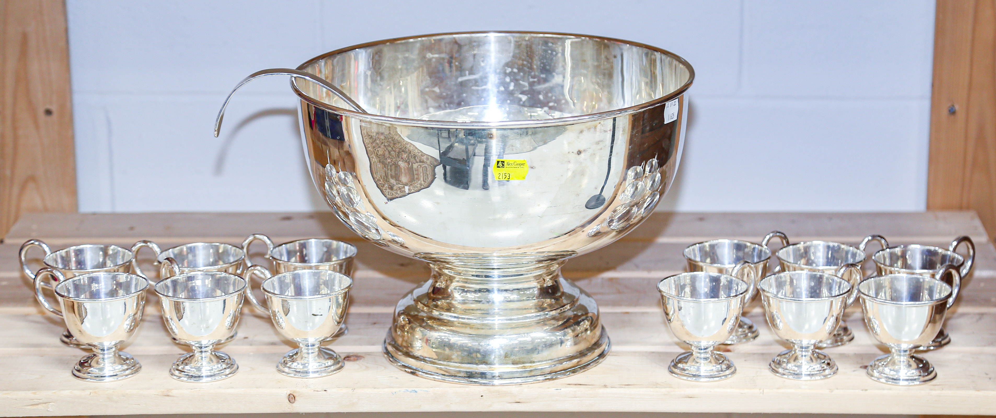 Appraisal: SILVER PLATED PUNCH BOWL WITH CUPS LADLE Punch bowl in