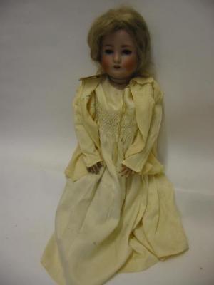 Appraisal: A bisque head doll with grey sleeping eyes open mouth