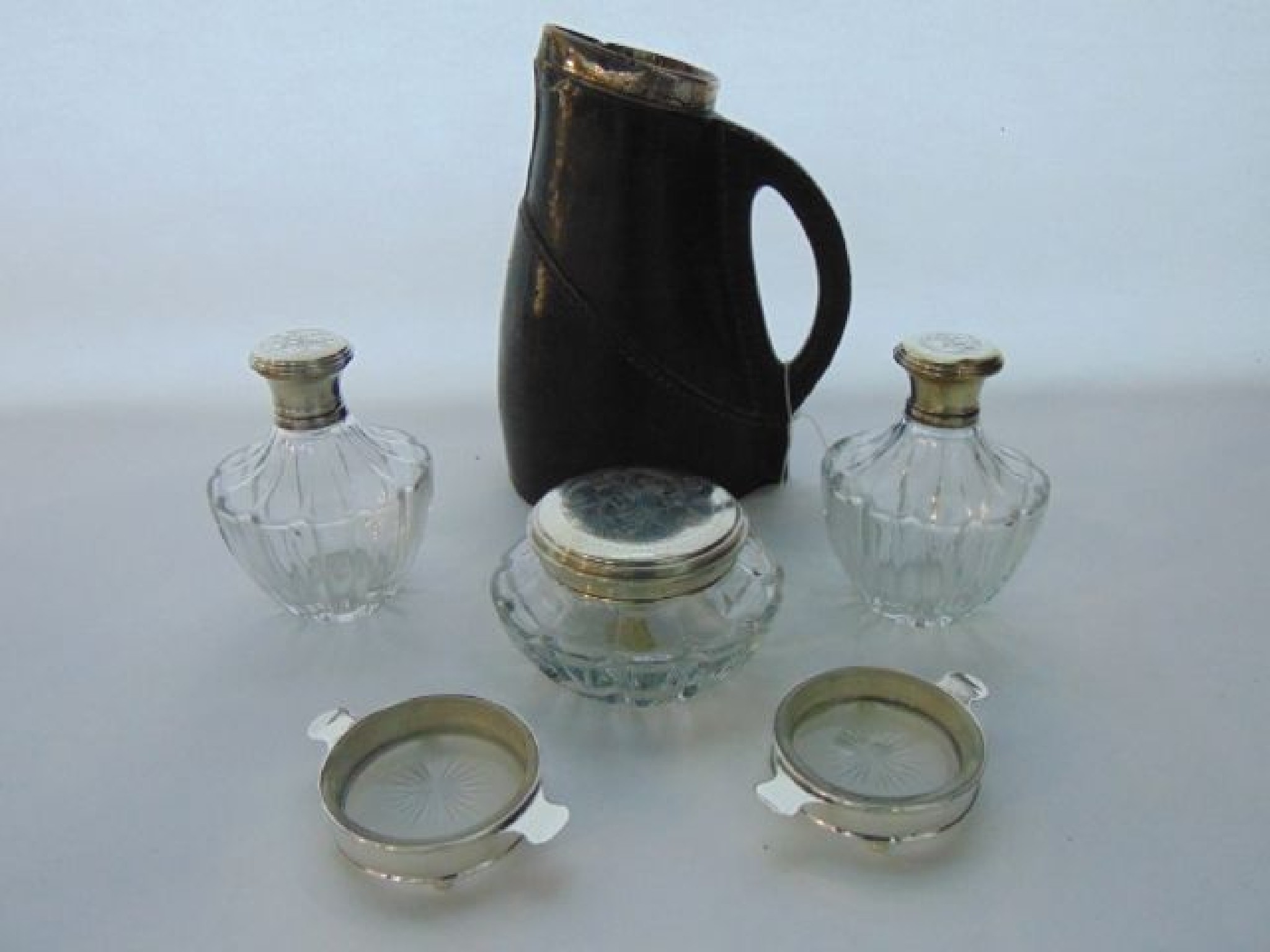 Appraisal: A ceramic flagon with a silver rim London cm high