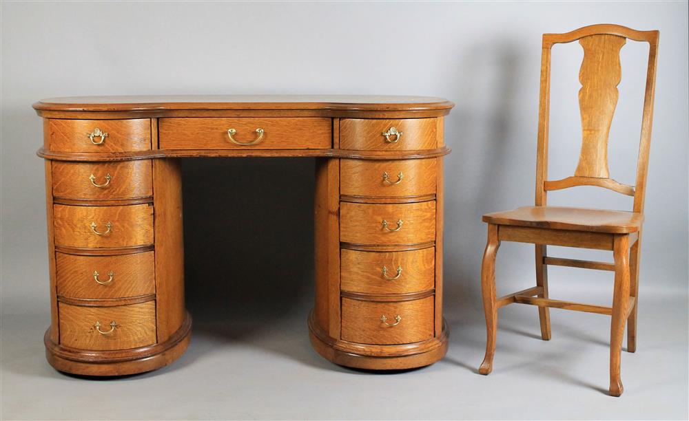 Appraisal: EMPIRE STYLE OAK KIDNEY-SHAPED FLAT TOP DOUBLE PEDESTAL DESK WITH