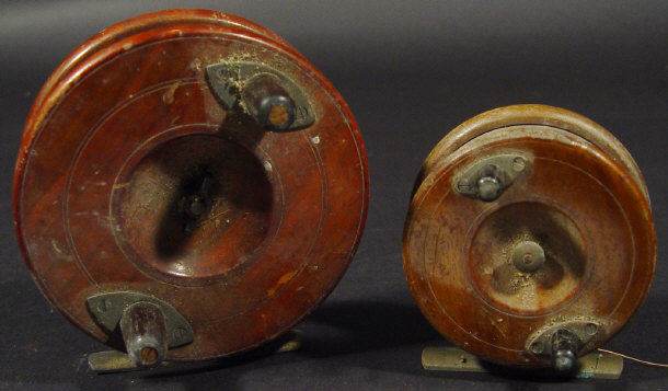 Appraisal: Two graduated mahogany fishing reels with brass mounts