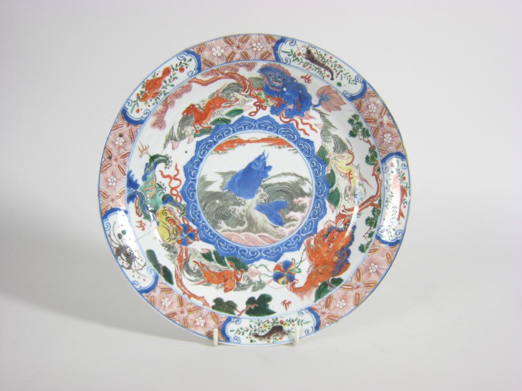 Appraisal: An th Century Chinese polychrome Plate painted rising carp horses