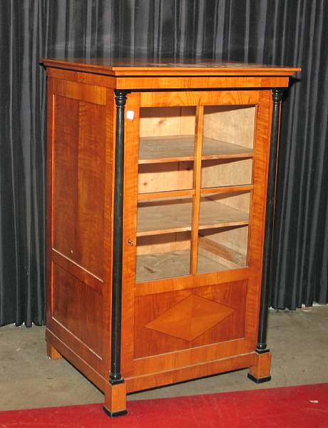 Appraisal: A pair of Biedermeier style parcel ebonized stained pine cabinets