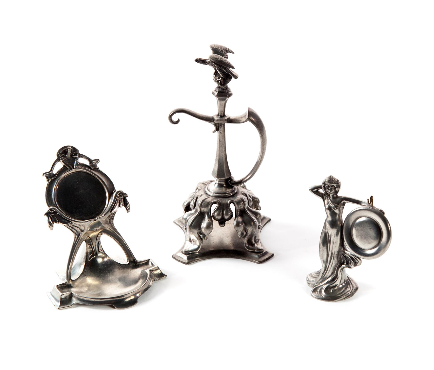 Appraisal: THREE PEWTER POCKET WATCH STANDS Twentieth century All stands have