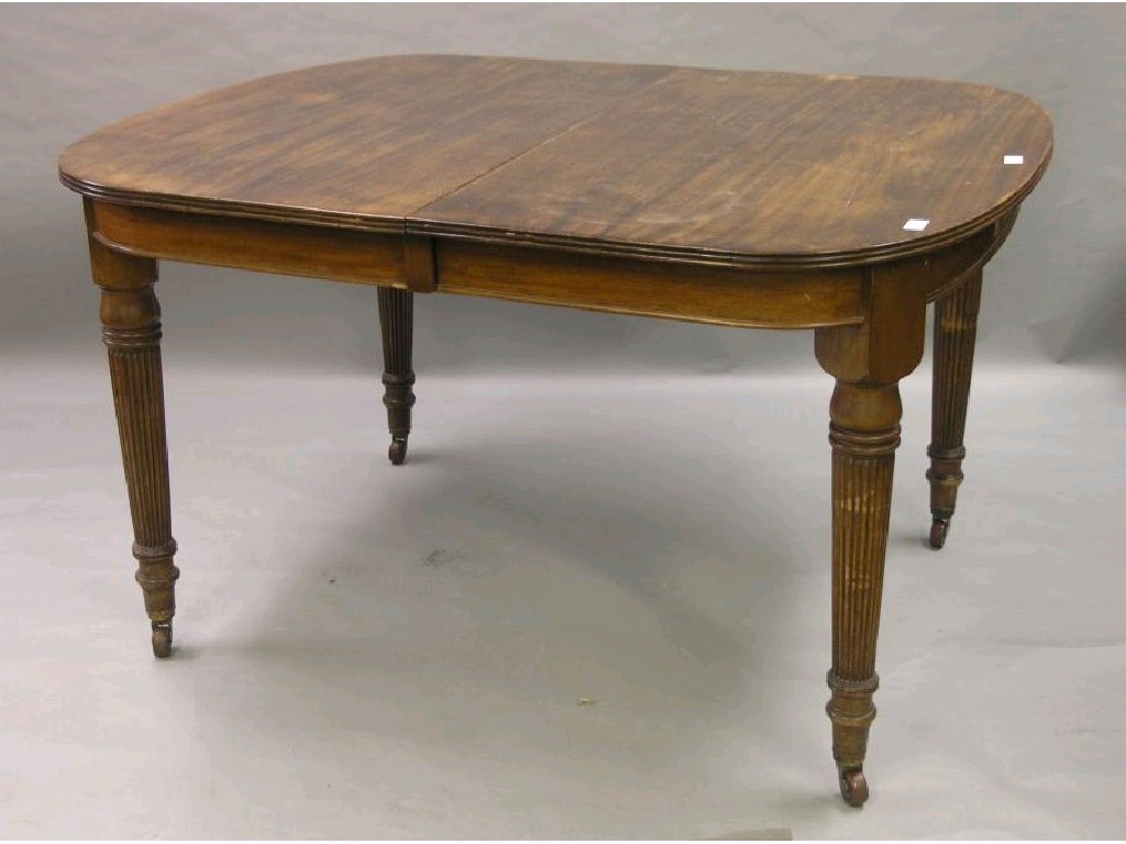 Appraisal: An early th century mahogany wind-action dining table turned and