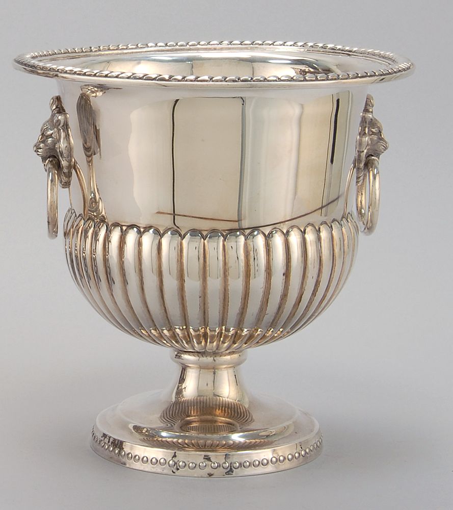 Appraisal: MEXICAN STERLING SILVER CHAMPAGNE BUCKET In half-ribbed design with lion's