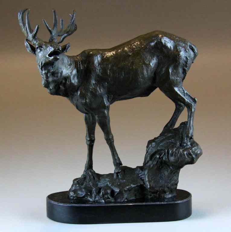 Appraisal: Bronze Sculpture Depicting An ElkA standing elk on rocky base