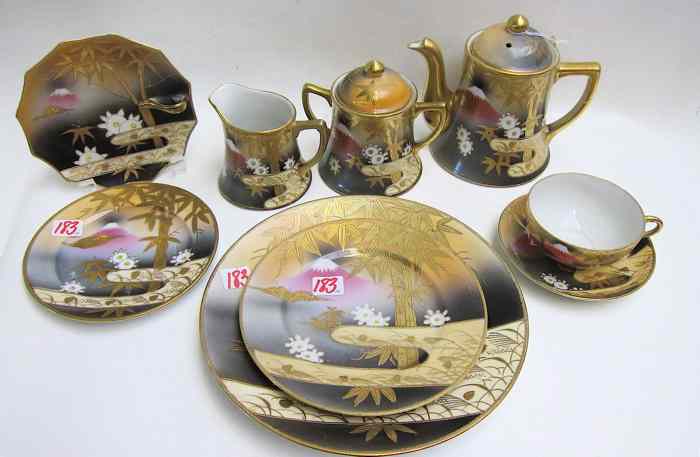 Appraisal: PIECE JAPANESE SHOFU CHINA SET having gold encrusted bamboo mountain