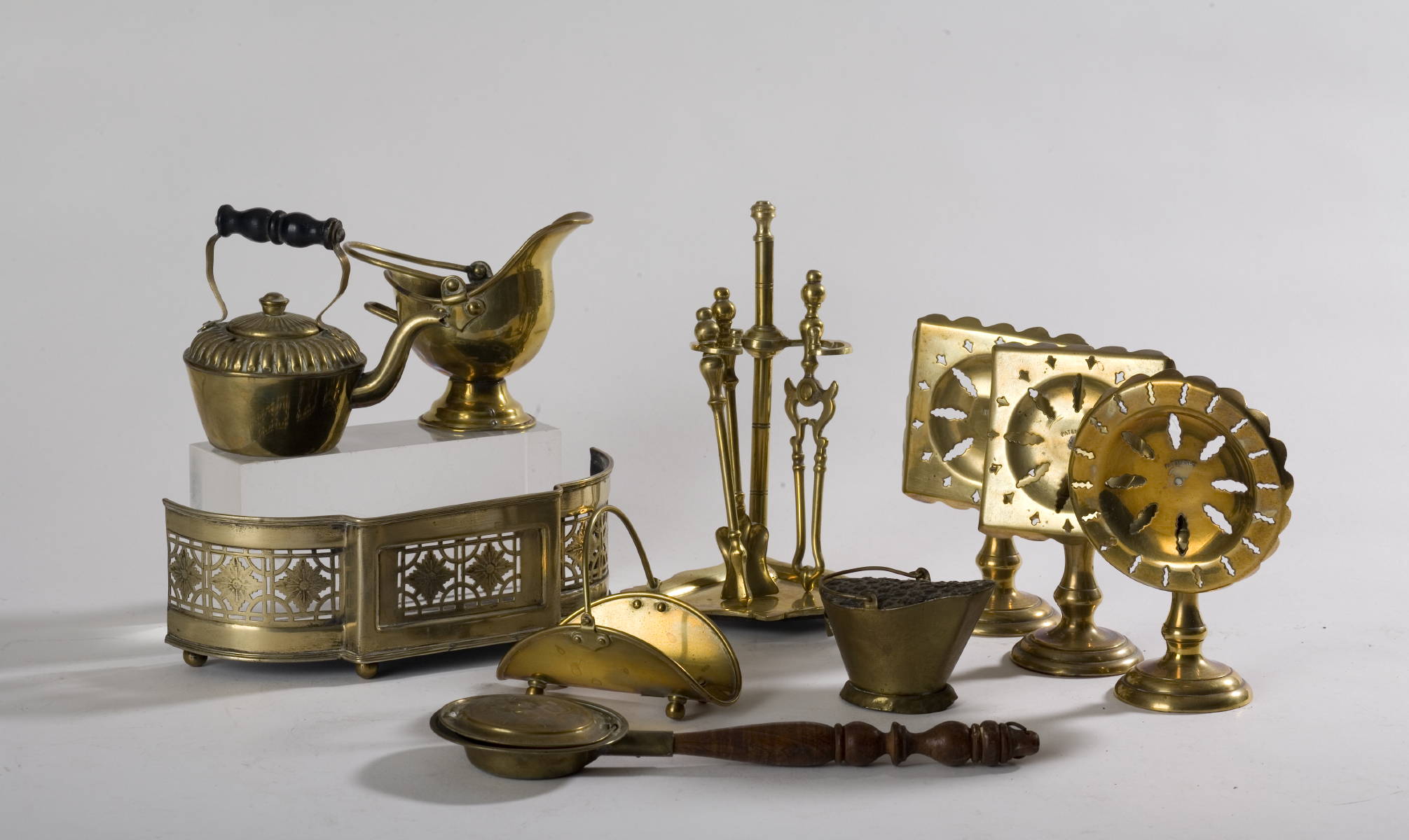 Appraisal: COLLECTION OF MINIATURE BRASS FIRE PLACE EQUIPMENT INCLUDING AN ENGRAVED