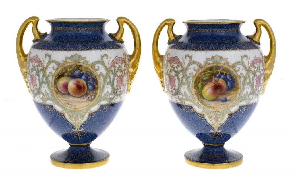 Appraisal: A PAIR OF ROYAL WORCESTER TWO HANDLED VASES of shield