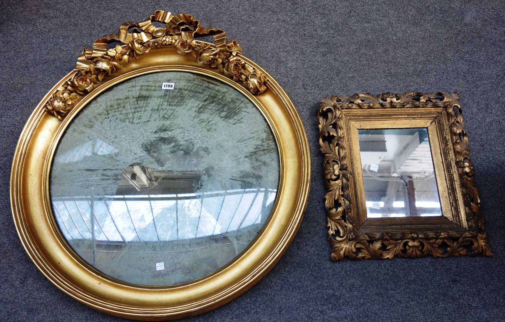 Appraisal: A th century gilt framed circular convex wall mirror with