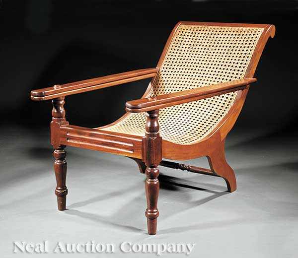 Appraisal: A Carved Mahogany Planter's Chair scrolled crest continuous back and