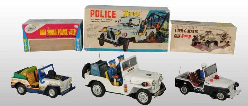 Appraisal: Lot of Tin Police Jeep Battery-Operated Toys Description Japanese Working