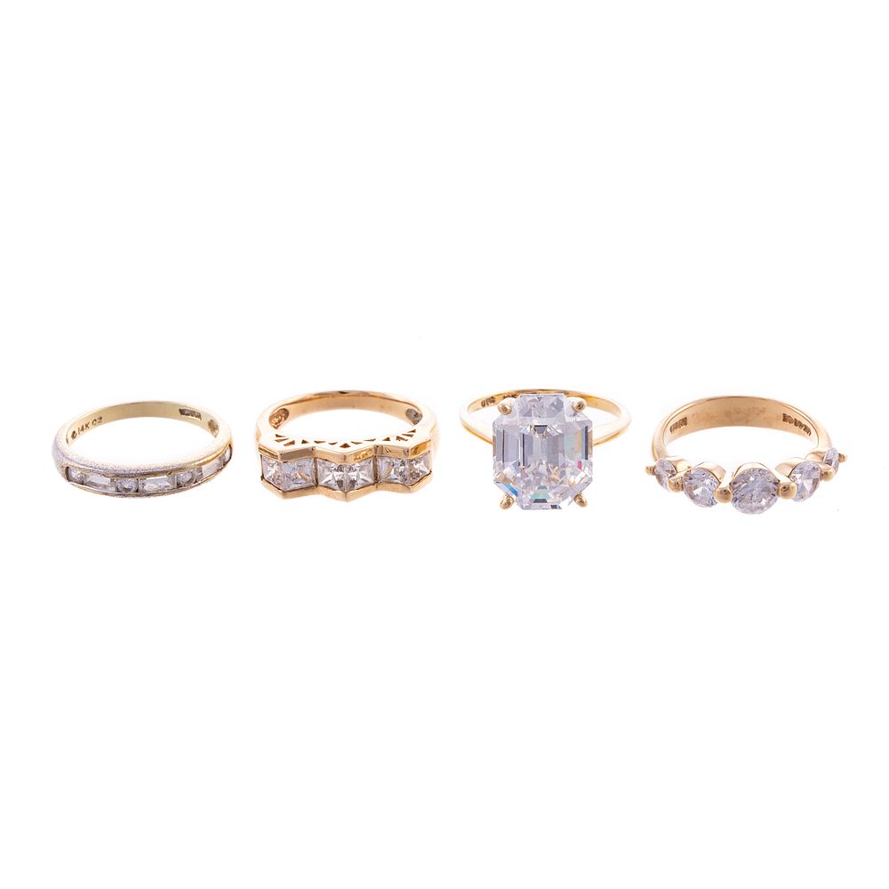 Appraisal: An Assortment of CZ Rings in Gold Three rings in