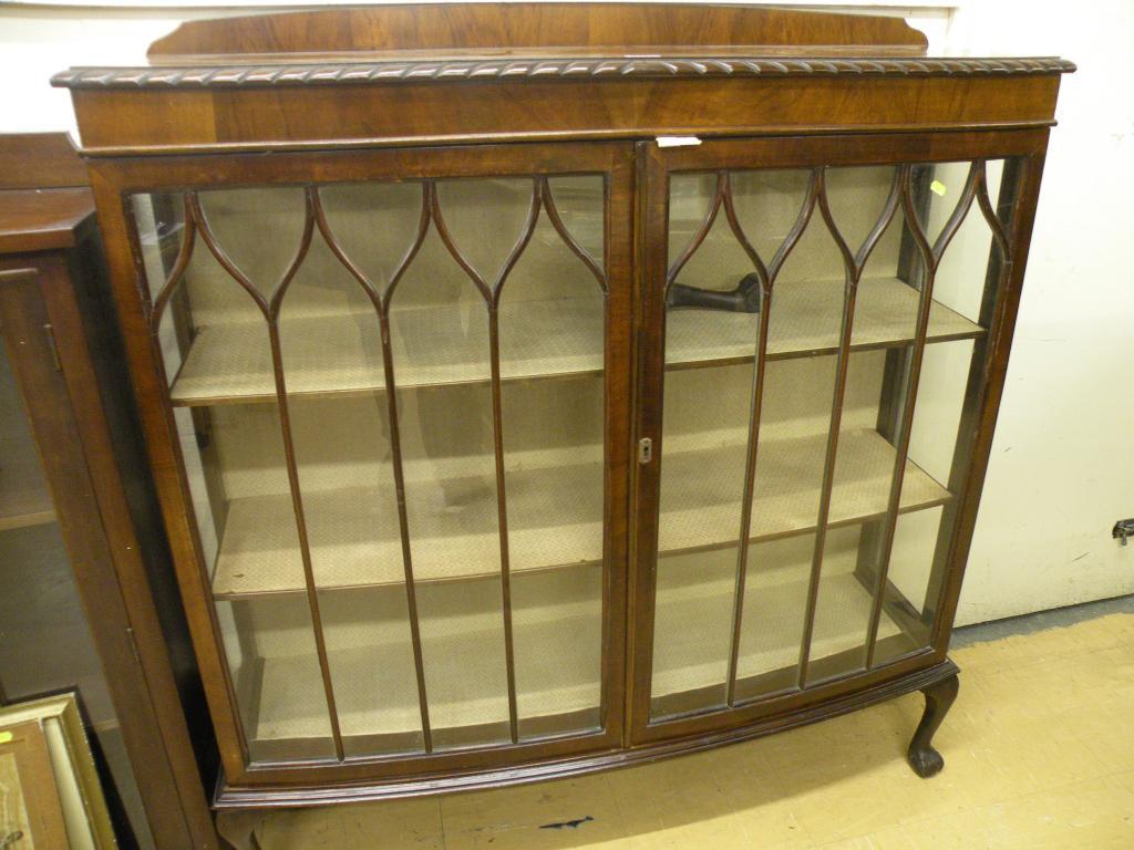 Appraisal: A mahogany display cabinet with two astragal glazed doors on