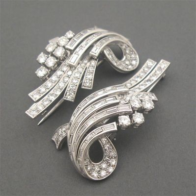 Appraisal: A pair of diamond set clips of scroll form and