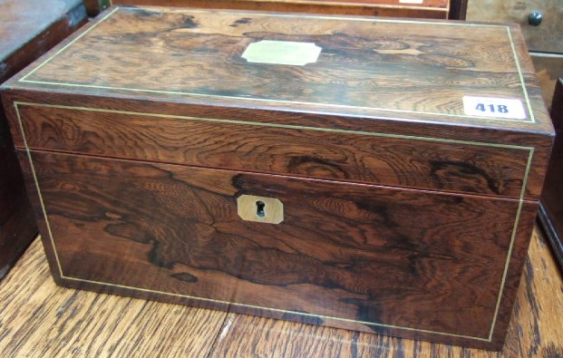 Appraisal: A Victorian rosewood and brass inlaid two division tea caddy