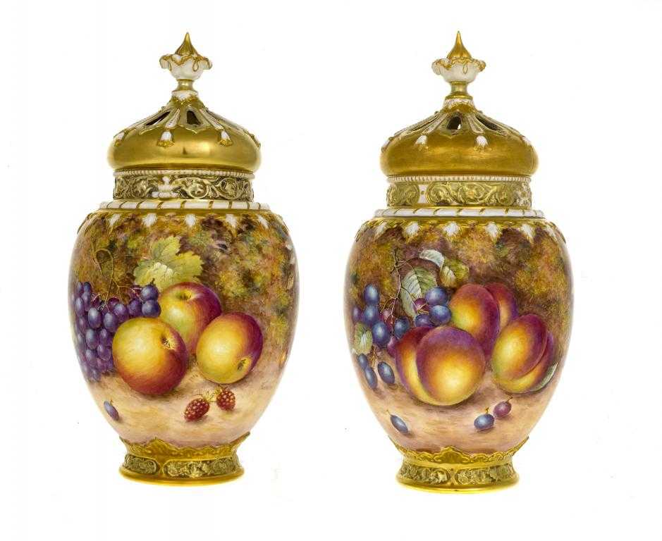 Appraisal: A PAIR OF ROYAL WORCESTER ROSE JARS AND COVERS the