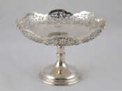 Appraisal: A silver comport with pierced border by Walker Hall Sheffield