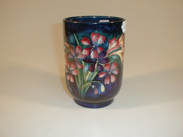 Appraisal: A Moorcroft Pottery Freesia Vase bucket shape decorated in pink