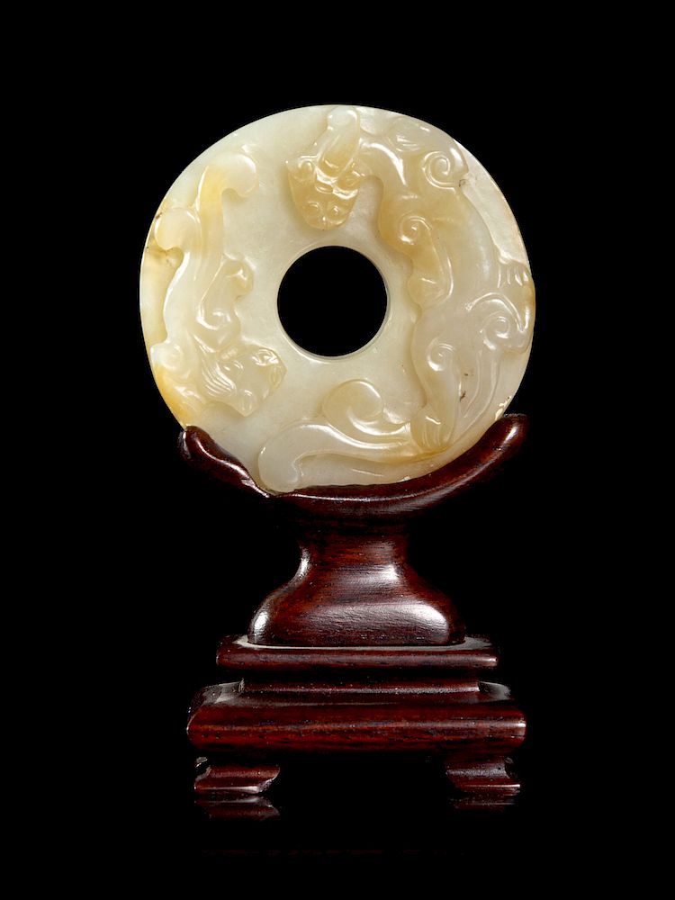 Appraisal: A Celadon and Russet Jade Bi Disk Diam in cm