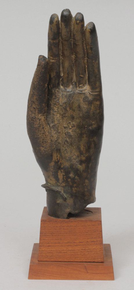 Appraisal: South East Asian Parcel-Gilt Bronze Hand On a wooden base