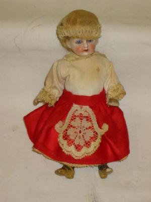 Appraisal: A bisque head dolls house doll with blue glass eyes