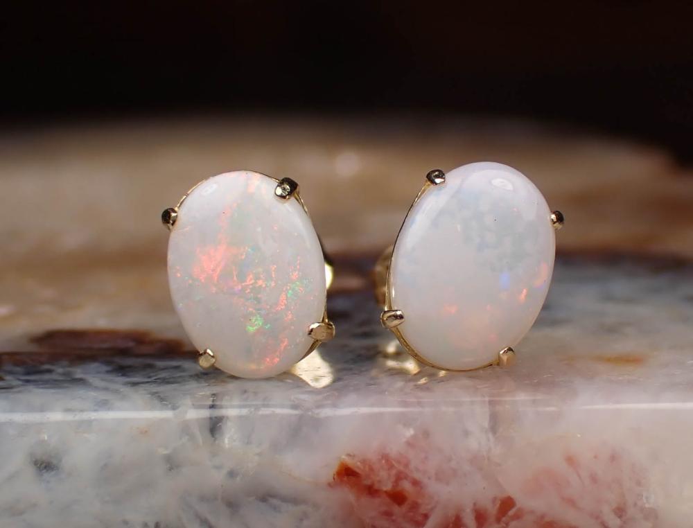 Appraisal: PAIR OF OPAL AND FOURTEEN KARAT GOLD EAR STUDS each