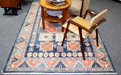 Appraisal: An Eastern rug of geometric design the indigo blue field