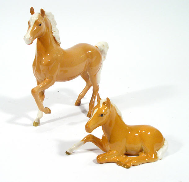 Appraisal: Hand painted tan Beswick horse with raised leg and a