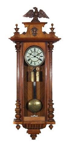 Appraisal: A WALNUT VIENNA REGULATOR TYPE WALL CLOCK the pediment with