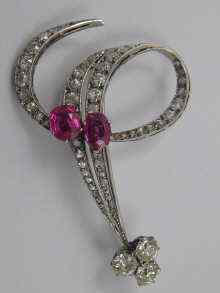 Appraisal: A fine diamond and ruby brooch c estimated diamond content