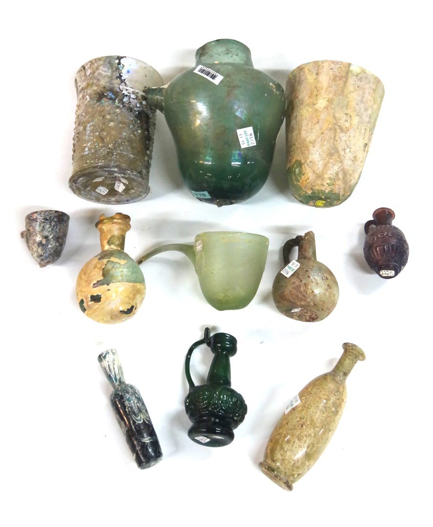 Appraisal: A group of Roman glass vessels comprising three pouring vessels