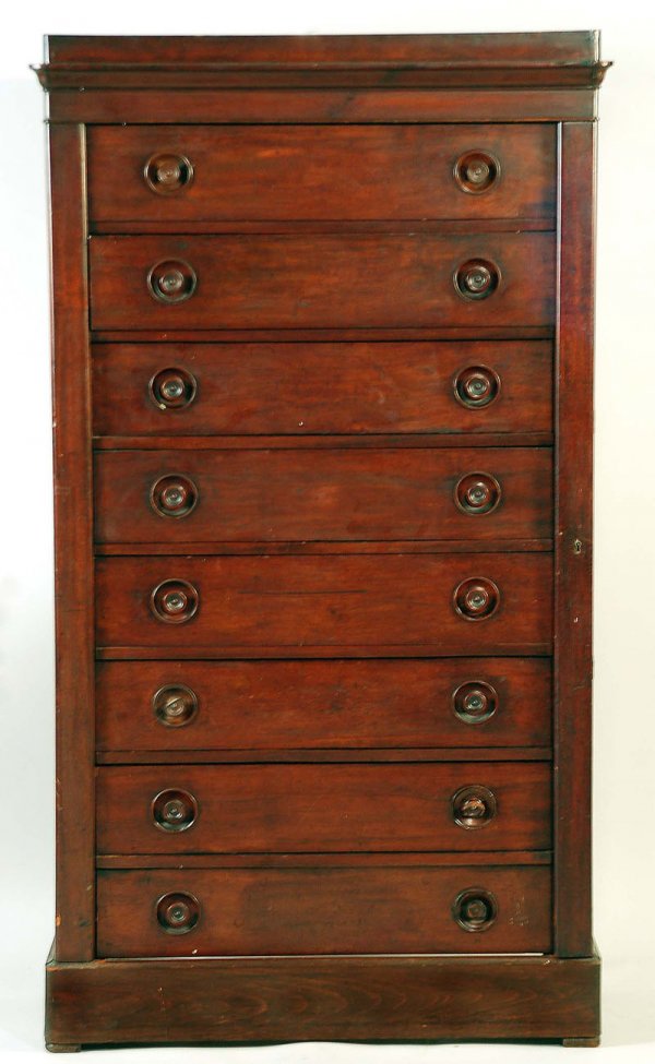 Appraisal: Mahogany veneer eight-drawer chest of drawers with hidden side lock