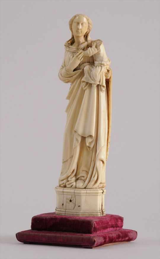 Appraisal: FRENCH CARVED IVORY GROUP OF THE VIRGIN AND CHILD Wearing