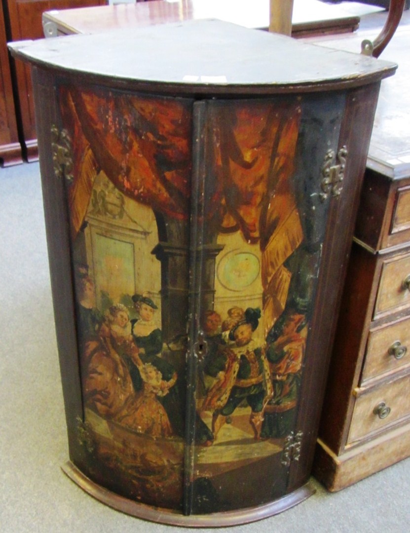 Appraisal: A th century bowfront hanging two door corner cupboard decorated