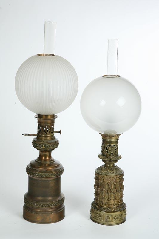 Appraisal: TWO MODERATOR LAMPS Brass one with ornate decoration Both have