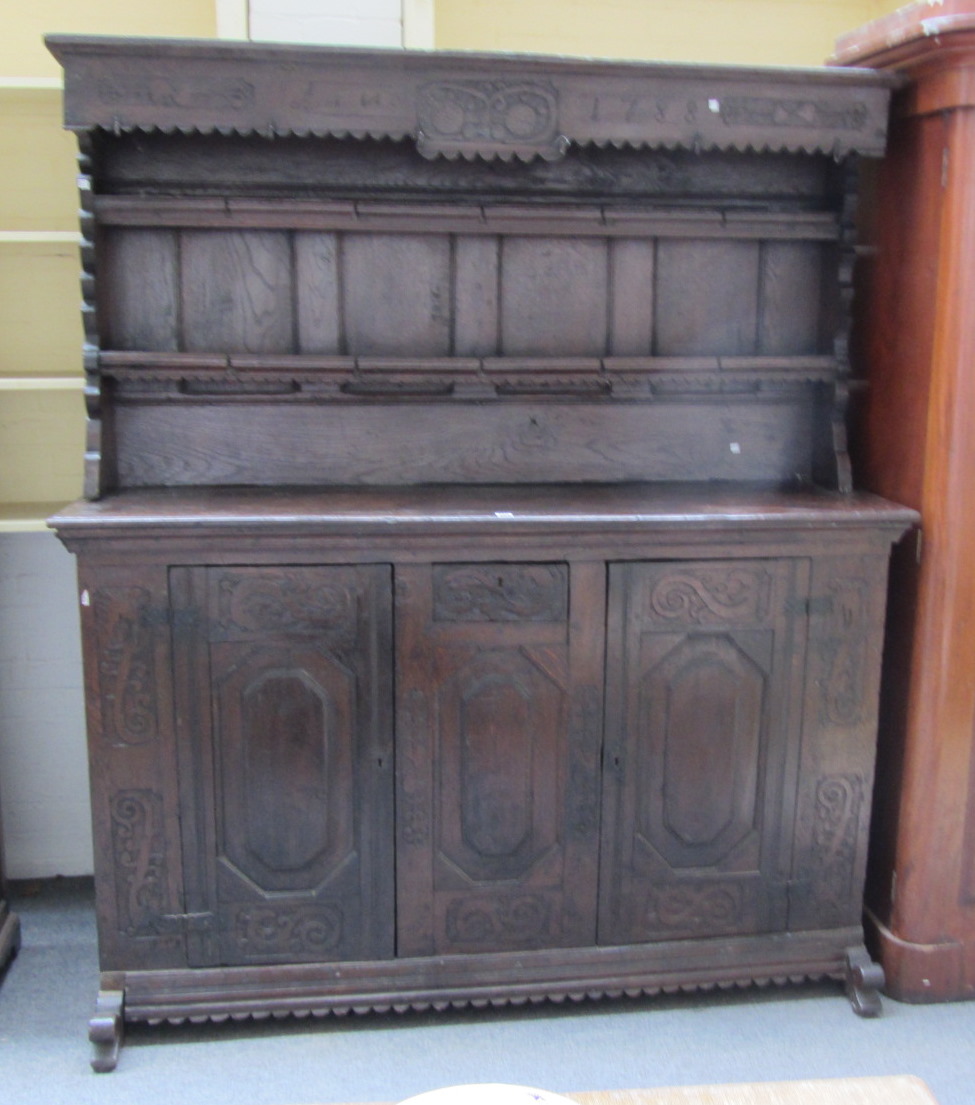 Appraisal: An th century and later German oak dresser the enclosed