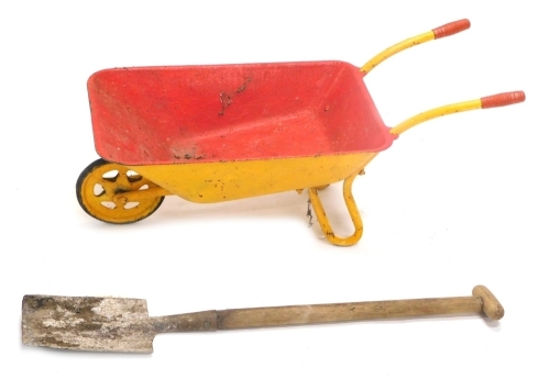 Appraisal: A child's metal wheelbarrow painted yellow and red with articulated