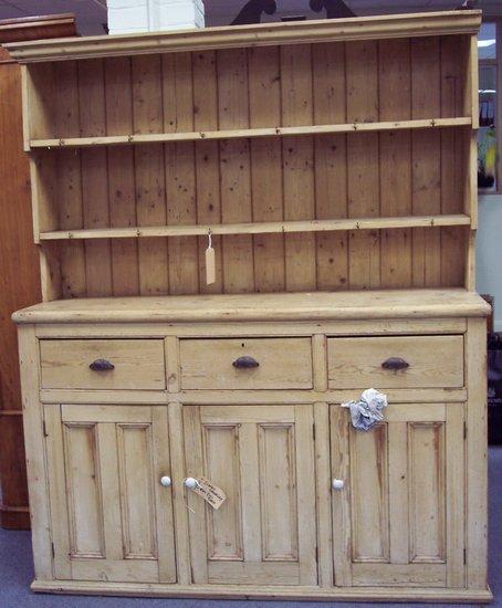 Appraisal: A Victorian pine dresser the enclosed rack above three drawers