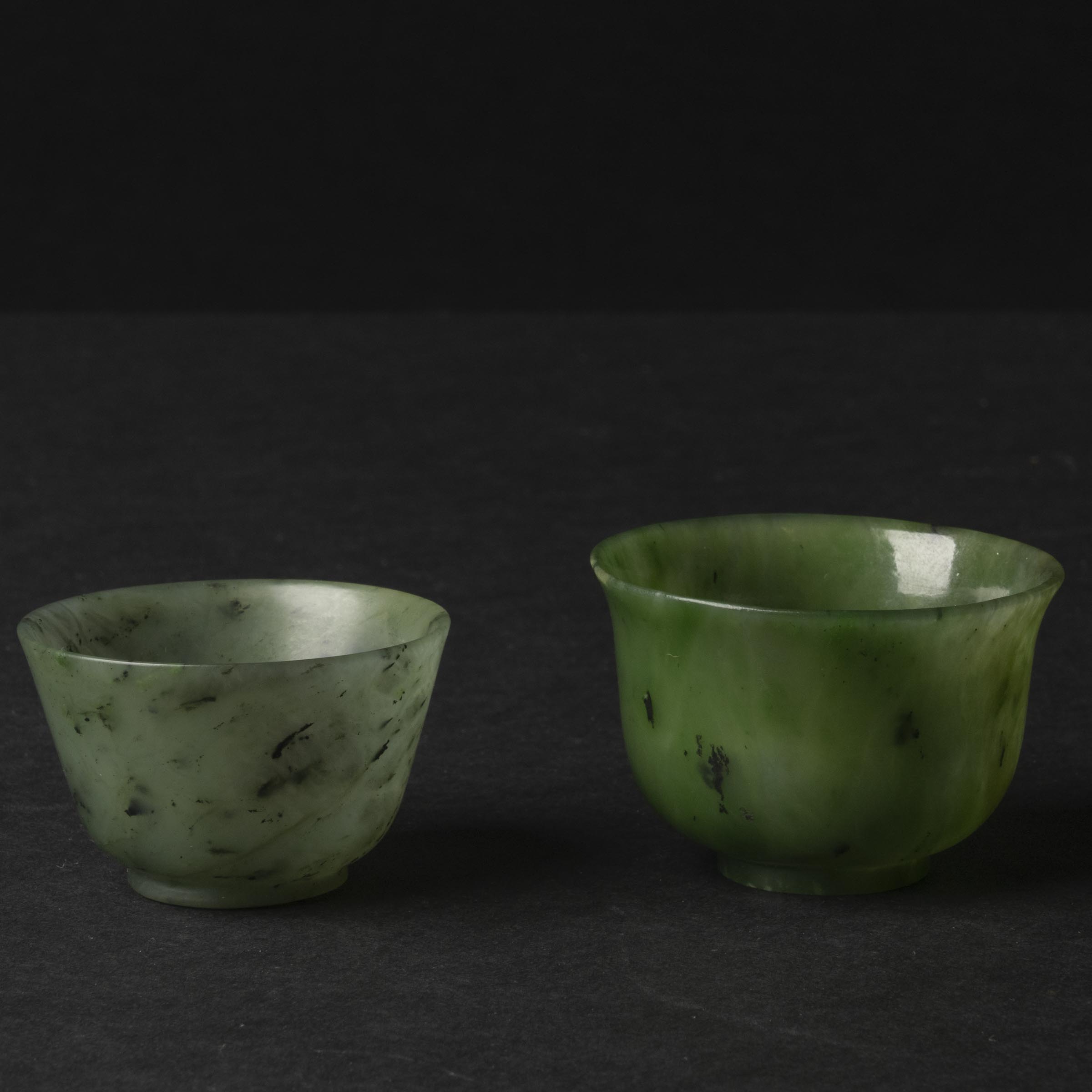 Appraisal: Two Spinach Jade Cups th Century The plain exterior polished