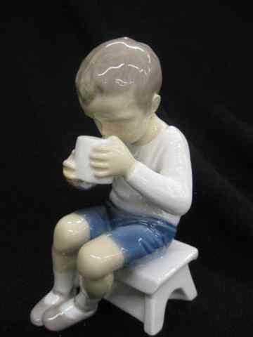 Appraisal: Bing Grondahl Porcelain Figurine of SeatedBoy drinking '' excellent