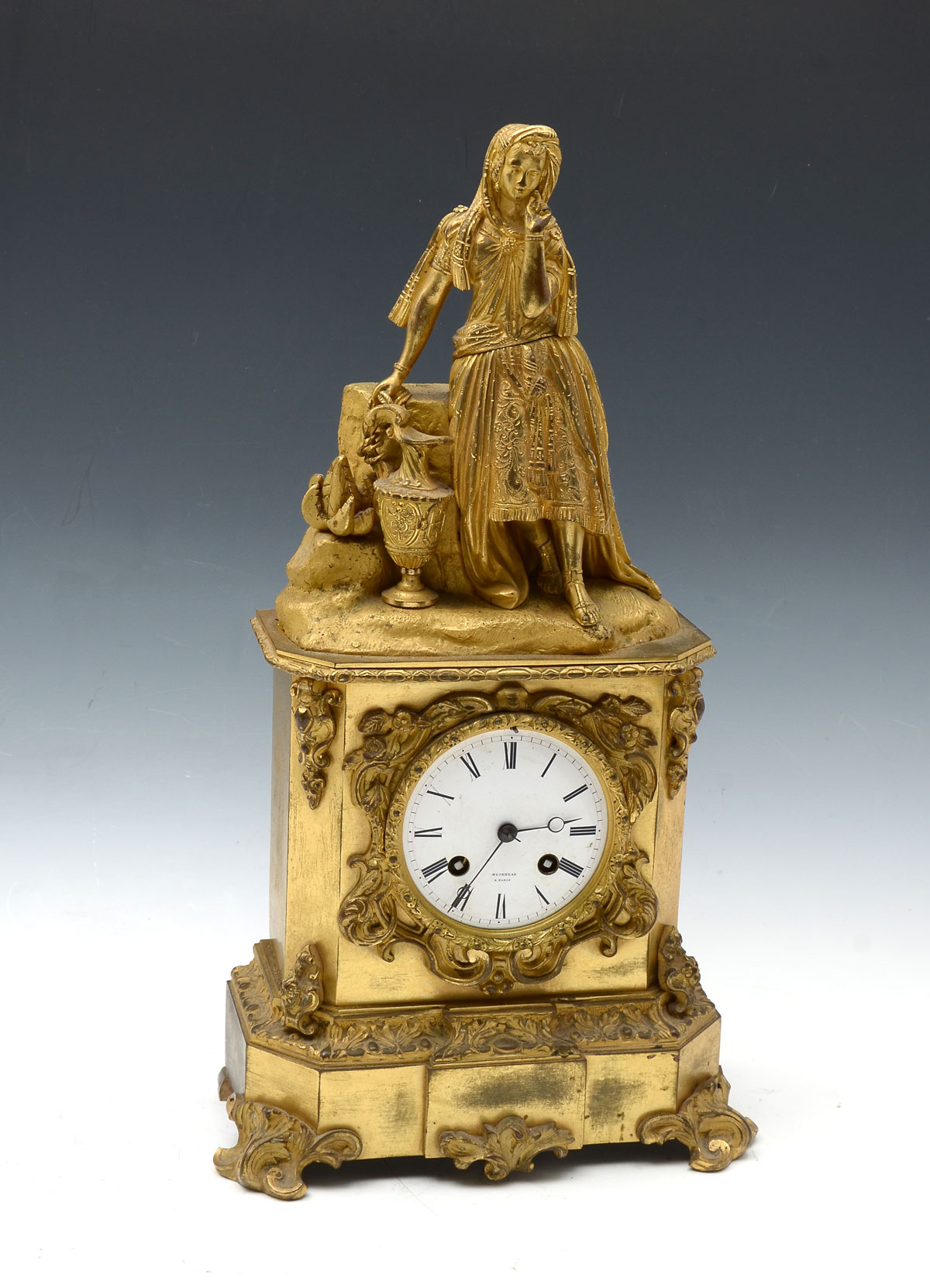 Appraisal: GILT MUIRHEAD FIGURAL MANTLE CLOCK Gilt French mantle clock having