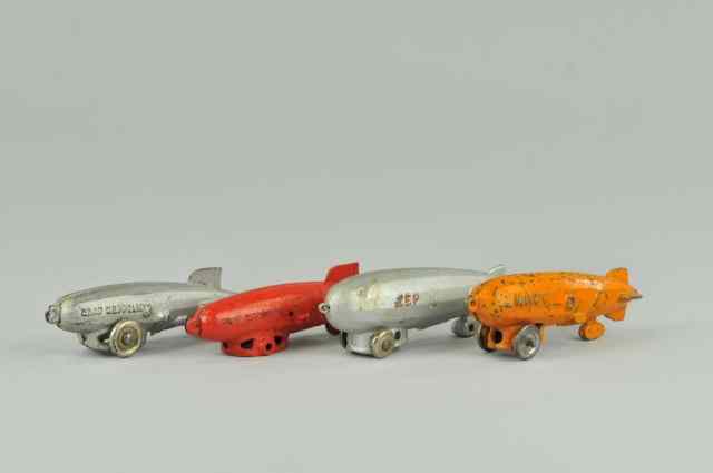 Appraisal: LOT OF FOUR BLIMPS A cast iron Graf Zeppelin by