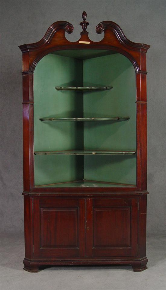 Appraisal: Mahogany Colonial Style Corner Cupboard Early th Century Flame finial