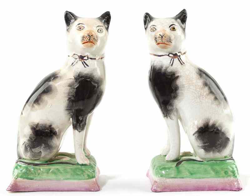 Appraisal: Pair of Staffordshire Seated Cats th century fully modeled spotted