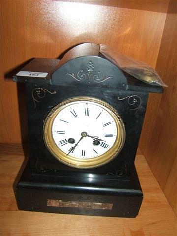 Appraisal: A Continental black slate mantel clock the circular enamelled dial