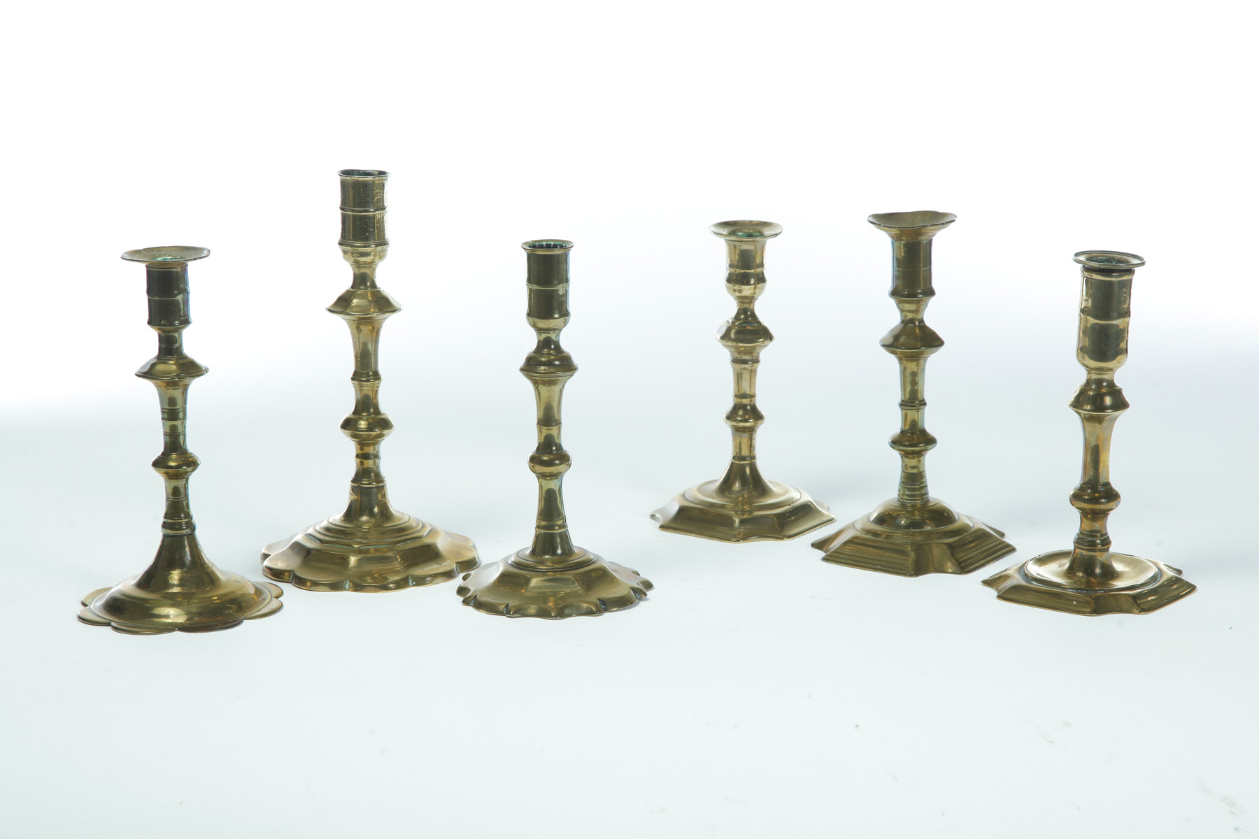 Appraisal: SIX ENGLISH BRASS CANDLESTICKS Mid th century Good forms including