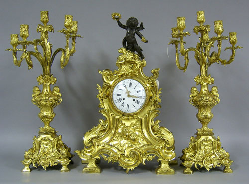 Appraisal: Marti et Cie gilt bronze clock garniture th c with