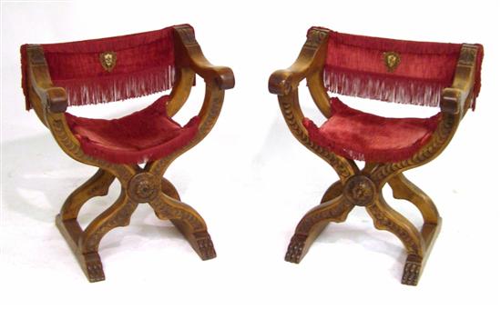 Appraisal: Pair of Savonarola style open arm folding chairs fringed red